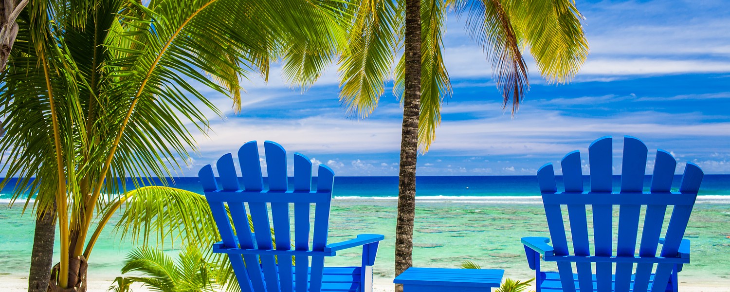 Two blue chairs on a beach front on amazing beach, Cook Islands