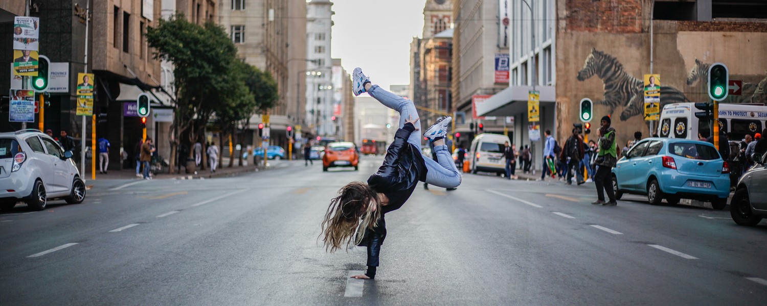 person breakdancing in the street