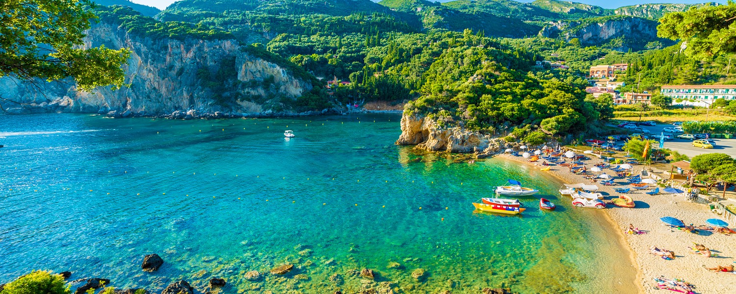 Beautiful beach and boat in Paleokastritsa, Corfu island, Greece