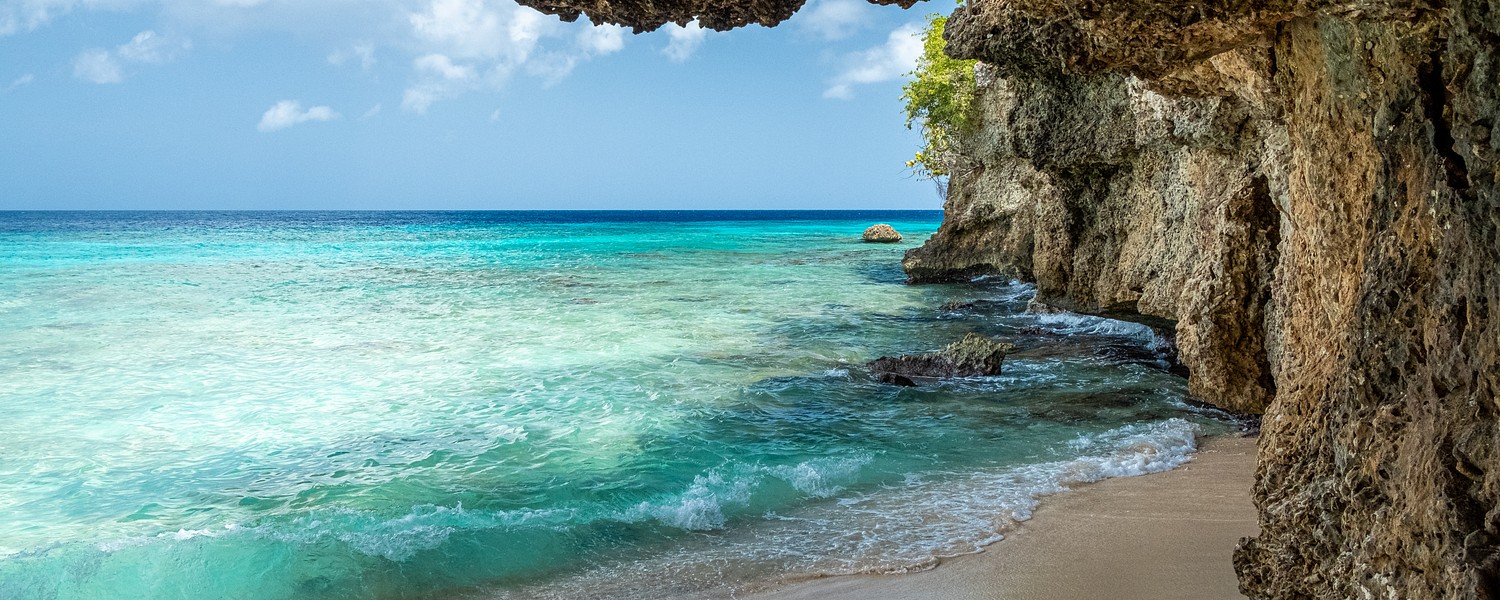 Cave with beach and ocean in curacao